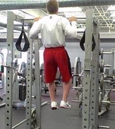 Stabilize your spine by tightening the abs and glutes then slowly pull your body towards the overhead bar.