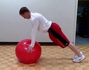 Push-UP (hands on ball) Coaching Tips: Place your hand shoulder width apart on a medium sized stability ball.