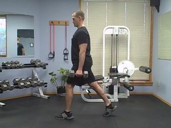 Split Squats-DB Coaching Tips: Start with the dumbbells comfortably positioned at your hips, with palms facing in.