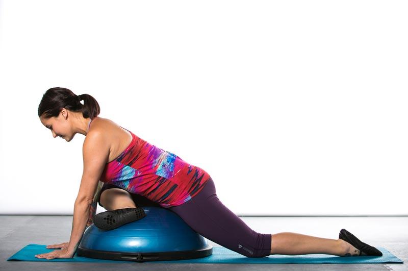 Pigeon externally rotates the leg, which lengthens the external rotators, piriformis and hamstrings. The BOSU supports the pelvis in a neutral position.