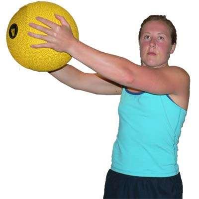 with the knees bent Lift the medicine ball in a diagonal line to high above the