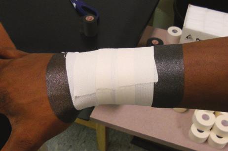 Apply pre-wrap starting at the base of the wrist and traveling proximally for three inches. 2.