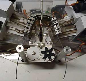 Gilbert objects with vertical planes of symmetry. 3,5,6 Be - cause the LAMDA robot works only on the x and y axes, it is relatively simple, compact, and inexpensive to manufacture.