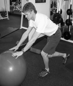 One legged squats with ball Stand on one leg with hands resting on