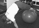 Slowly roll ball in by bringing knees in to chest. Work up to two sets of twenty.
