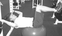 A Reverse Crunch Start by lying on back on top of ball with ball at lower back and hands above