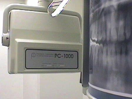 Chapter 1 Getting the Most Out of Panoramic Radiographic Interpretation Fig. 1.6 The panoramic latent image is created as the film cassette moves past the secondary slit.