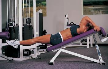 Starting Position: Lie on your back on a decline bench, holding onto the top of the bench.