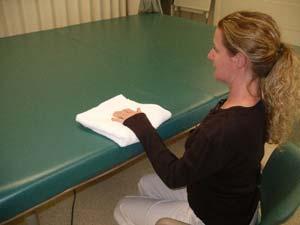 ACTIVE AND ASSISTED ROM EXERCISES WEEK 4 1. Table Slides. Sit facing a table with your hand on top of a towel.