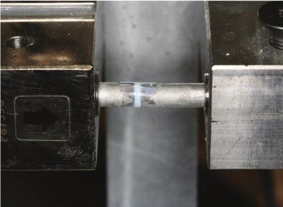 SHRINKAGE STRESS Shrinkage stress was measured by a machine that holds two 6 mm diameter stainless steel rods end to end with a 2 mm gap between them.