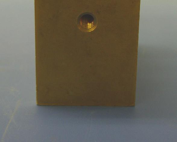 For shear testing the specimens were placed in a brass block so that the bracket base was located exactly at the edge of this holder (Figure 5.1).