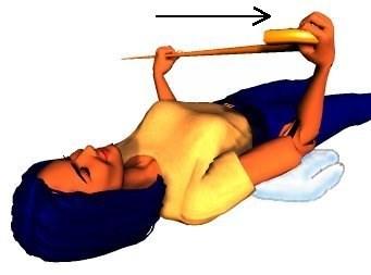 Lie on your back with your elbows on folded towels so that they are level with your shoulders.