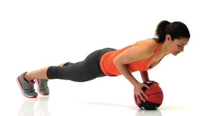 your chest nearly touching the ball. 2. Push up to a straight arm position.
