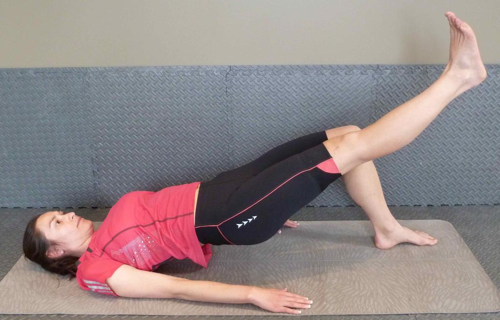 Tighten your buttock and hamstring muscles to lift your leg towards the ceiling as high as you can.