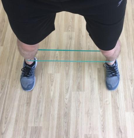 Place a band above knees on base of the thighs.