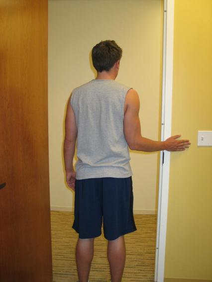 FOUR CORNERS STRETCH 3. External Rotation Stand in a doorway with your hand on the wall as shown.