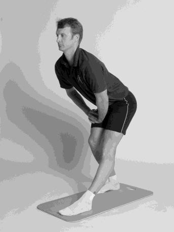 Back of thighs (Hamstrings) "Standing Hams" Alternate Position "Lying Hams" 23) Stand with feet staggered back to front.