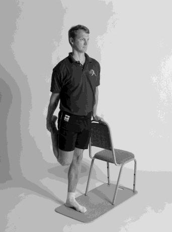 Front of thighs (Quadriceps) "Standing Quads" Alternate Position "Lying Quads" 30) Stand tall with support for balance.