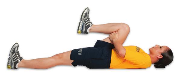 chest, placing one hand on knee & one under ankle Pull leg to chest with