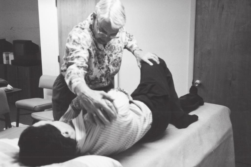 ROLLING TO SIDELYING ON THE LESS AFFECTED SIDE As the patient turns his head, the therapist facilitates head lift. As upper body turns, legs follow.