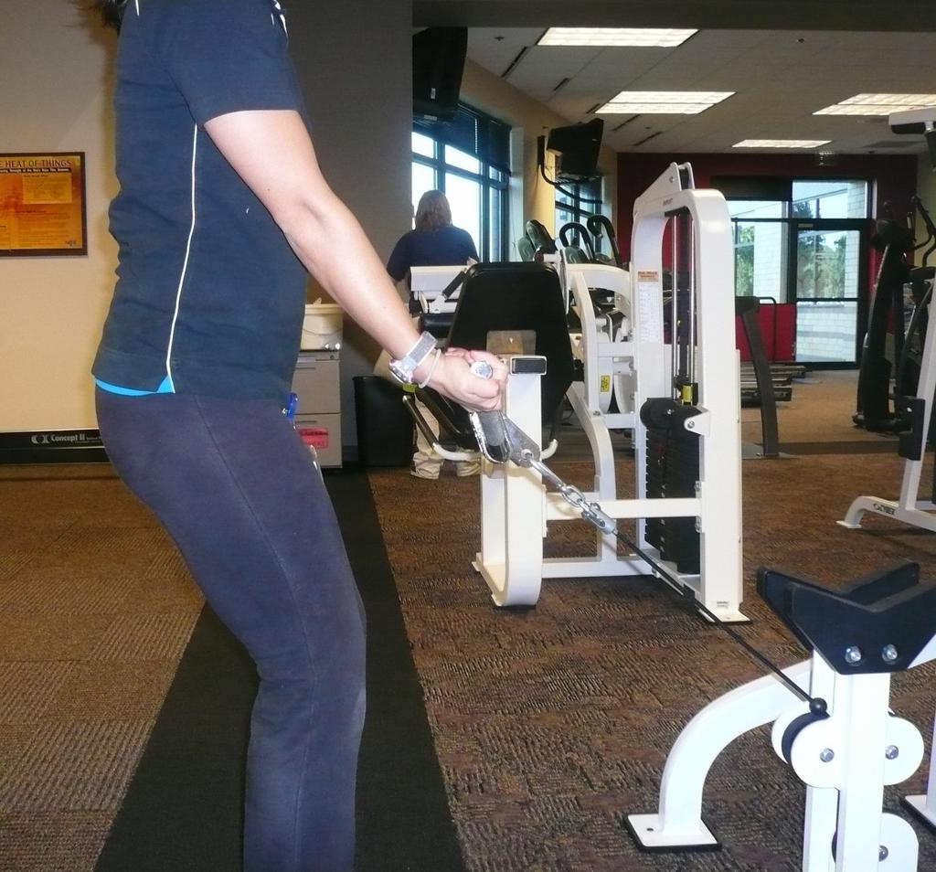 Step away from the machine and be sure you have a good stance, with a slight bend in the knees and back straight.