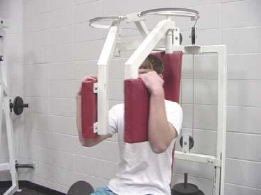 Viatly is using the PEC DECK. This exercise focuses o n the INNER PECTORAL MUSCLES (Chest).