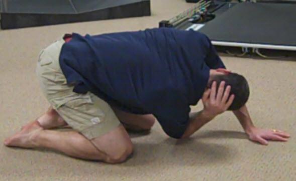 Place the hand on the stomach/ribs and work to pull the shoulder back to the floor.