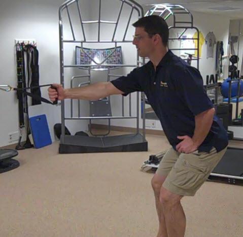 Single Arm Row with Trunk Rotation (Squat Stance) stand facing the band or cable in a ¼ to ½