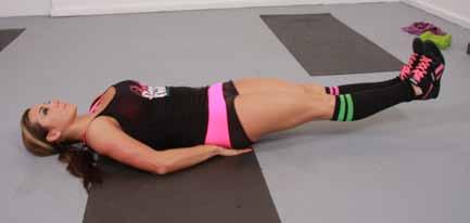 LEG RAISE WITH POP UP Preparation: Lie on back with hands under butt to support