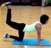 1. Lie with lower stomach/upper hips on ball in the push-up position with hands on floor in front of you. 2.
