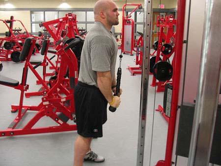 Position your hands shoulders width on the attachment