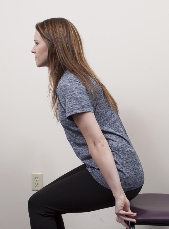 * If unable to safely stand without using your arms, support yourself with your arms as shown in the picture Tighten your stomach and stand up. With control, sit back down again.