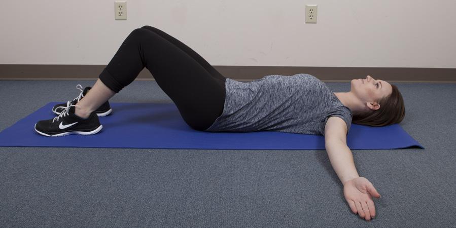 Back and Shoulder Stretch: This exercise stretches your upper back and shoulders. Lie on the floor.