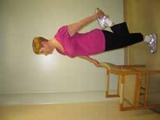 2. Quadriceps (thighs) This exercise stretches the muscles in the front of the thigh. Stand on one foot using a chair for balance.
