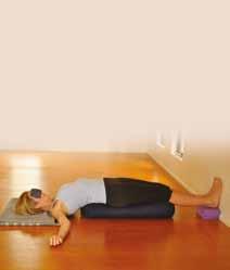 Reclining Open Twist with a bolster Replenishes the adrenal glands; by keeping your head turned towards your knees allows spaciousness in the belly.