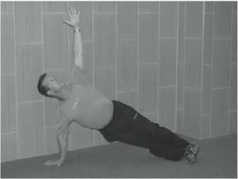9 One-Arm Bridge: Advanced Exercise That Builds Your Core Muscles Hold for one minute on each side of the body.