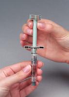 Attach the plunger to the gray rubber stopper in the syringe by turning the plunger clockwise