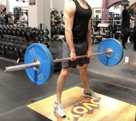 Start with a deadlift stance, feet outside shoulder width apart and your