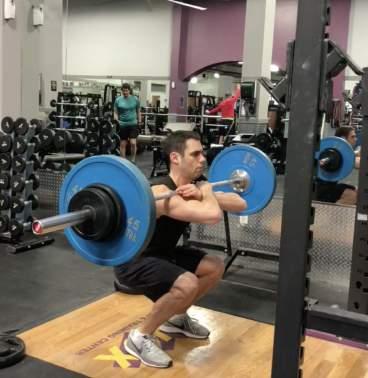 With your feet a little closer than shoulder width apart squat down as you keep your elbows as high