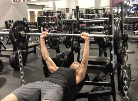 Bench Press With Chains 1. Lie on the bench and grasp the bar shoulder width. 2.