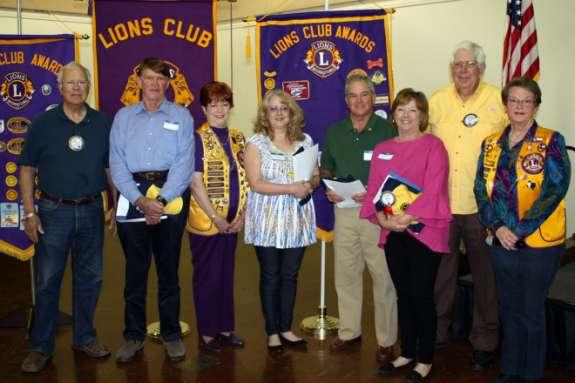 Pictured left to right Lion Jim McMeans, who sponsored new Lion Jim Jones, Lion Lee Gibson who sponsored new Lion Cindy Forsyth, New