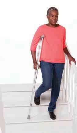 Support your weight evenly between the rail and the crutches. With the crutches and operated leg on the lower step, step up with your unoperated leg.