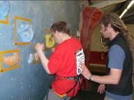 climbing at an inside climbing wall during