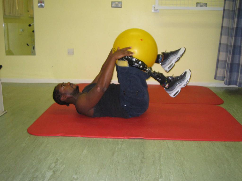 floor Transfer ball to hands Slowly lower legs and arms towards