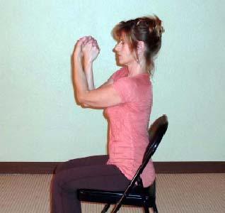 Active Chair Yoga with Sherry Zak Morris Here I am doing the same Knuckle Knot, trying my best to keep my palms together as I thread the hands down and under.
