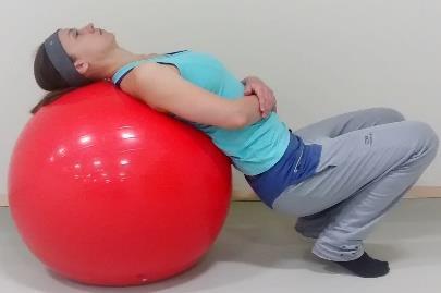 Hold the stretch 30 seconds. Repeat it twice. Movement: Lean back on a gym ball or foam roller to extend your back.