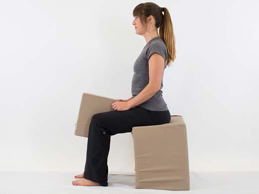 1. Sitting Knee Pillow Squeezes Do 3 sets. Each set consisting of 20 repetitions. 1. Sit in the middle of a chair with your feet pointed straight ahead, 4-6 inches apart. 2. Place a pillow between your knees.