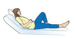Bend your left leg and place your foot flat on the bed (see Figure 7). 3.