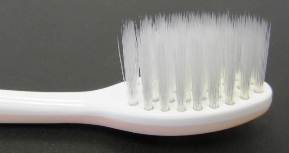 Figure 1. Meridol special toothbrush with conical filaments Control group toothbrush with rounded filaments (ADA reference toothbrush - Figure 2)