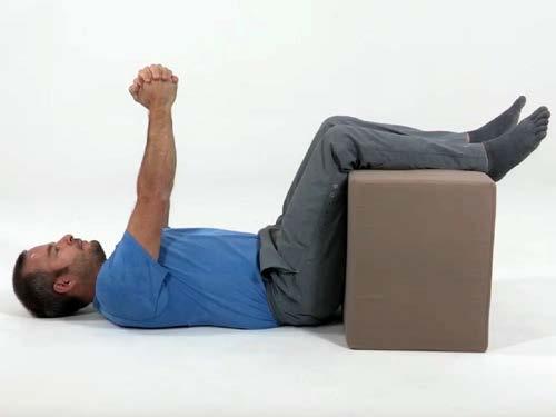 3. Static Back Pullovers Do 3 sets. Each set consisting of 10 repetitions. 1. Lie on your back with your legs up over a large block or chair, knees bent at 90 degrees. 2.